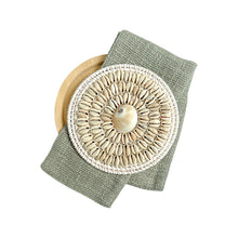 Load image into Gallery viewer, White coastal cushion with a sage colour sash, wrapped around the lumbar cushion with shell and rattan detail is a must for a coastal style. 
